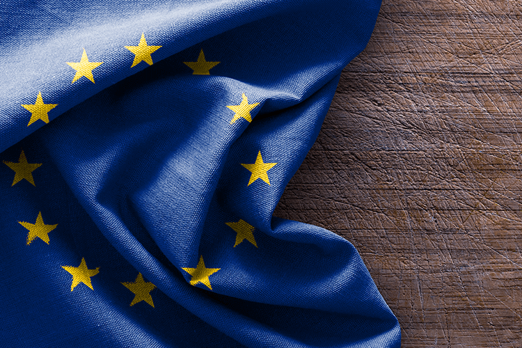 European Union flag on wooden background. Symbol of unity and cooperation among European countries
