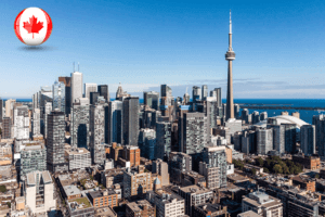 Aerial view of Toronto, Canada with a skyline of tall buildings and a waterfront