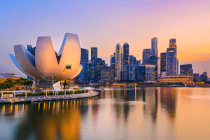 City skyline with a towering building in the foreground, showcasing urban architecture and modernity