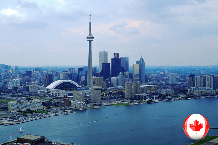 City skyline with Canadian flag flying high. A patriotic symbol against a backdrop of urban architecture
