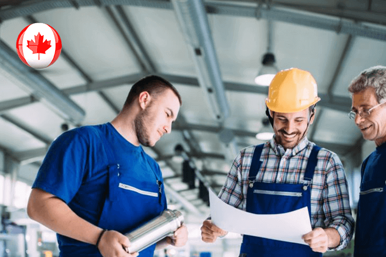 Canadian manufacturing jobs: Skilled workers operating machinery in a factory, contributing to the country's industrial growth