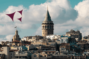 A cityscape with a towering structure and a vibrant