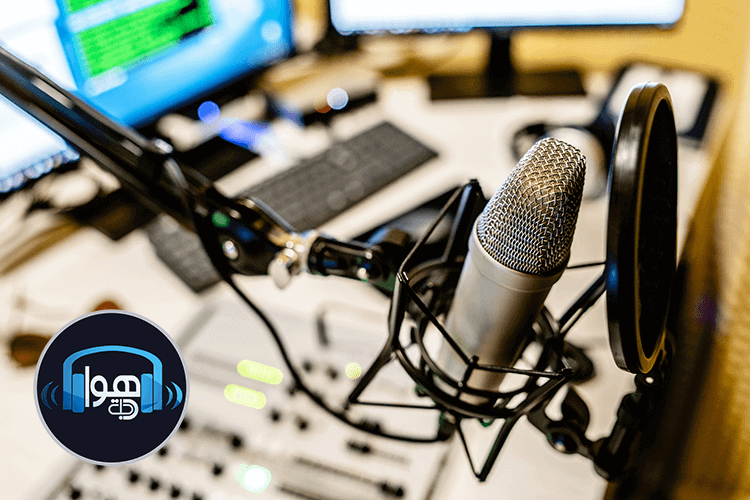 A microphone and computer monitor on a desk at Hawa Dajla Radio station
